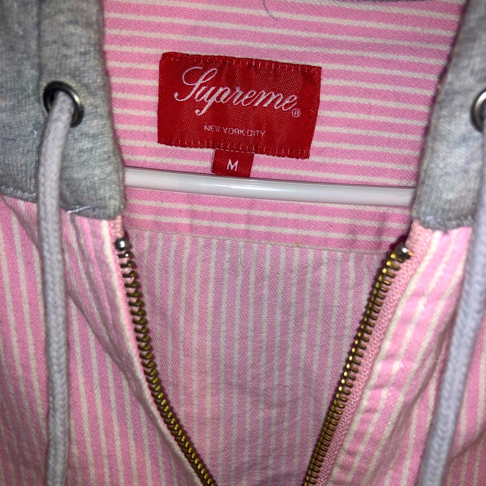 Supreme zip up hoodie.